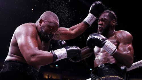 Wilder cae, se levanta y vence a Chisora en una guerra dividida